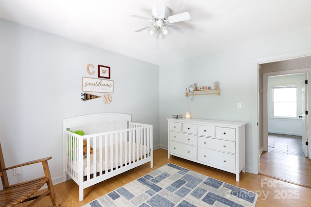 1631 Amanda Ln, Rock Hill, SC 29730 - bedroom featuring light wood-style floors, a nursery area, and ceiling fan