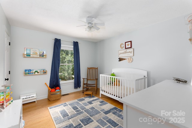 1631 Amanda Ln, Rock Hill, SC 29730 - bedroom with a nursery area, wood finished floors, and a ceiling fan