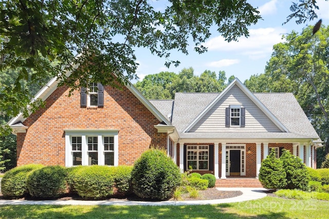 20308 Ridgebrook Ln, Locust, NC 28097 - view of front of property with brick siding, covered porch, and a shingled roof