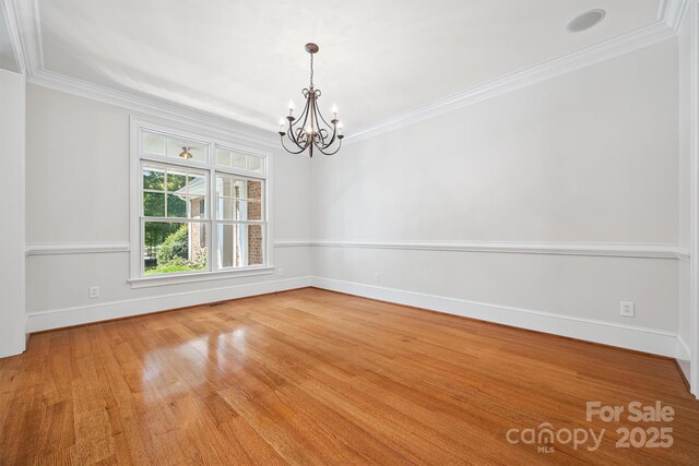 20308 Ridgebrook Ln, Locust, NC 28097 - unfurnished room with a chandelier, ornamental molding, and wood finished floors