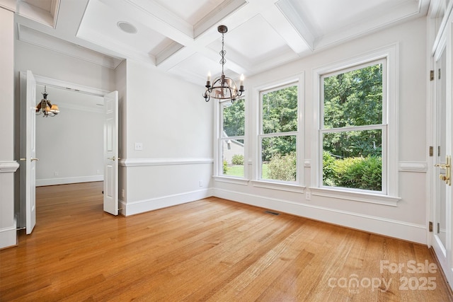 20308 Ridgebrook Ln, Locust, NC 28097 - unfurnished dining area featuring a chandelier, coffered ceiling, light wood-type flooring, plenty of natural light, and beam ceiling