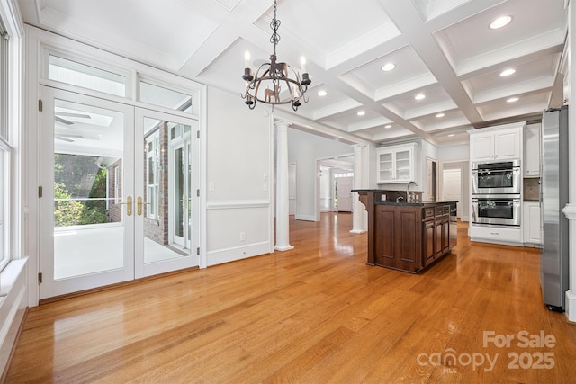 20308 Ridgebrook Ln, Locust, NC 28097 - kitchen with stainless steel appliances, coffered ceiling, beamed ceiling, recessed lighting, and white cabinetry