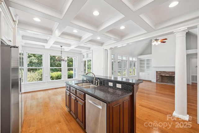 20308 Ridgebrook Ln, Locust, NC 28097 - kitchen featuring stainless steel appliances, ornate columns, beam ceiling, light wood-style flooring, and recessed lighting