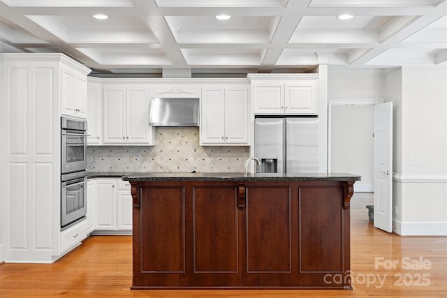 20308 Ridgebrook Ln, Locust, NC 28097 - kitchen with appliances with stainless steel finishes, wall chimney exhaust hood, recessed lighting, light wood-style flooring, and white cabinets
