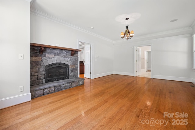 20308 Ridgebrook Ln, Locust, NC 28097 - unfurnished living room featuring ornamental molding, a chandelier, wood finished floors, and a fireplace