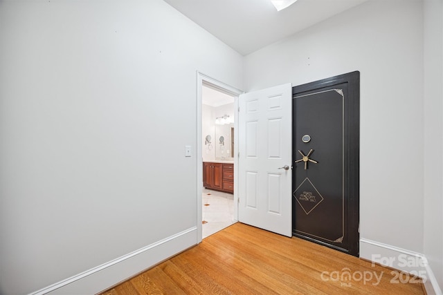 20308 Ridgebrook Ln, Locust, NC 28097 - unfurnished bedroom with light wood-type flooring and baseboards