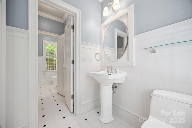 20308 Ridgebrook Ln, Locust, NC 28097 - bathroom featuring tile patterned flooring, a wainscoted wall, and crown molding