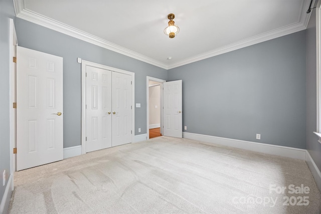 20308 Ridgebrook Ln, Locust, NC 28097 - unfurnished bedroom featuring crown molding, carpet floors, and a closet