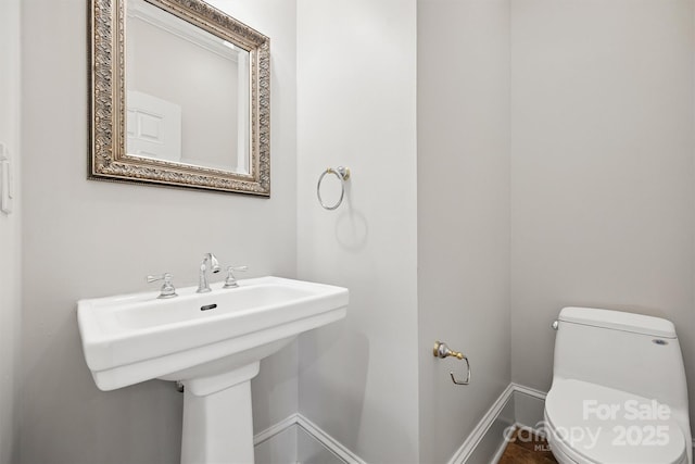 20308 Ridgebrook Ln, Locust, NC 28097 - half bathroom featuring toilet and baseboards