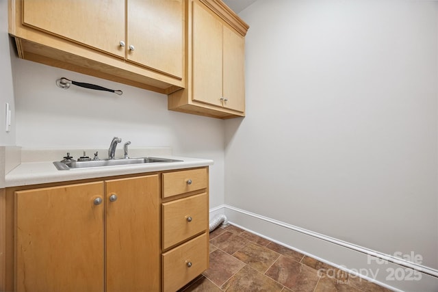20308 Ridgebrook Ln, Locust, NC 28097 - laundry room featuring cabinet space and stone finish flooring