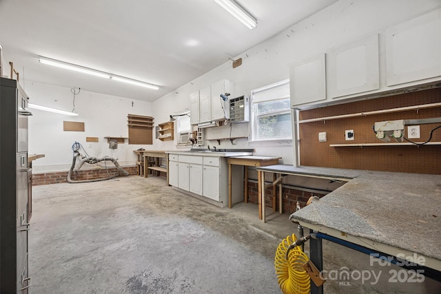 20308 Ridgebrook Ln, Locust, NC 28097 - kitchen with white cabinets and concrete floors