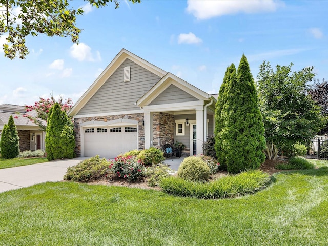 1313 Haywood Park Dr Unit 11, Waxhaw, NC 28173 - view of front of house with driveway, a front yard, an attached garage, and stone siding
