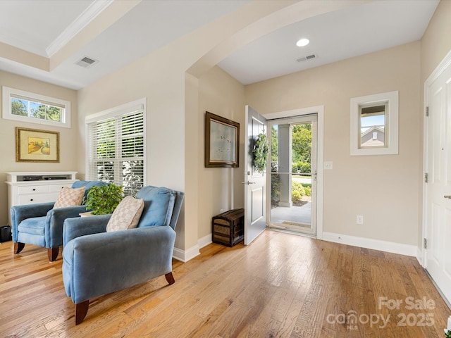 1313 Haywood Park Dr Unit 11, Waxhaw, NC 28173 - entrance foyer featuring arched walkways, light wood-style flooring, crown molding, recessed lighting, and a raised ceiling