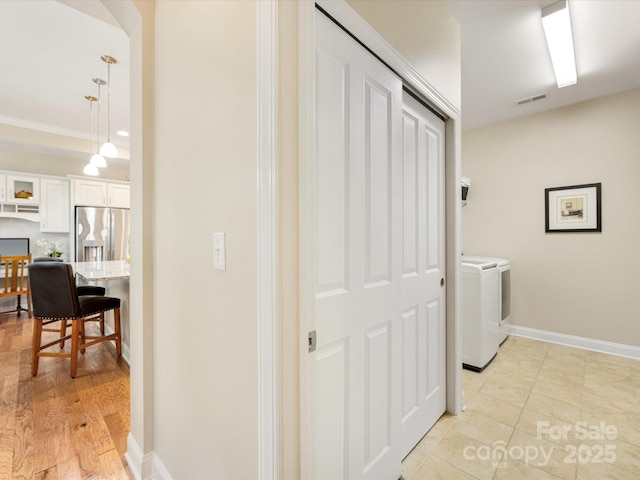 1313 Haywood Park Dr Unit 11, Waxhaw, NC 28173 - washroom with washer and dryer and baseboards