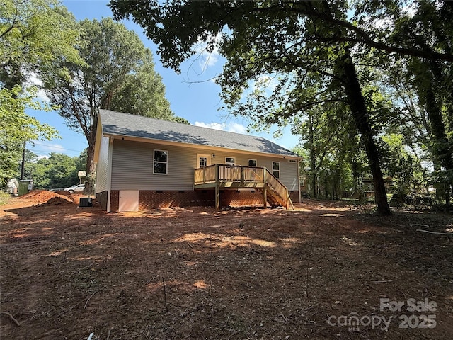 613 3rd Street Pl SW, Conover, NC 28613 - back of property with crawl space, a wooden deck, a shingled roof, and stairs