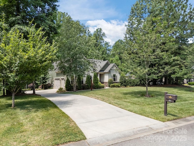 113 Chaska Loop, Troutman, NC 28166 - view of front of house with driveway, a front yard, and a garage