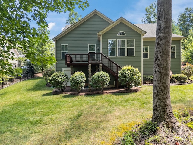113 Chaska Loop, Troutman, NC 28166 - rear view of property featuring a wooden deck, a yard, and stairway
