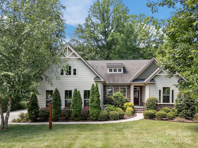 113 Chaska Loop, Troutman, NC 28166 - craftsman-style home featuring a front yard, stone siding, and a shingled roof