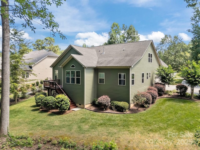 113 Chaska Loop, Troutman, NC 28166 - back of property with stairway, a wooden deck, a lawn, roof with shingles, and crawl space