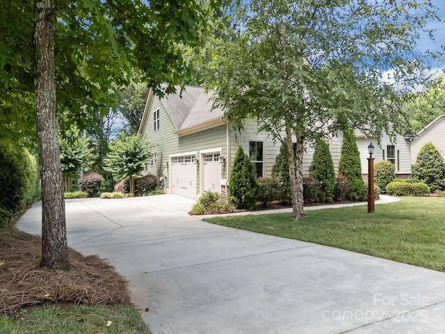 113 Chaska Loop, Troutman, NC 28166 - view of front of property with driveway, a front lawn, and a shingled roof