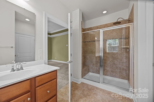 113 Chaska Loop, Troutman, NC 28166 - bathroom featuring a stall shower, vanity, recessed lighting, and tile patterned flooring