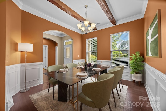 113 Chaska Loop, Troutman, NC 28166 - dining room featuring a wainscoted wall, arched walkways, a chandelier, beam ceiling, and a decorative wall