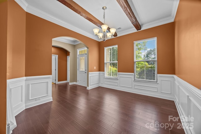113 Chaska Loop, Troutman, NC 28166 - unfurnished room with a chandelier, beamed ceiling, arched walkways, a wainscoted wall, and dark wood finished floors