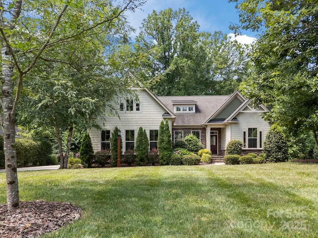 113 Chaska Loop, Troutman, NC 28166 - view of front of property with a front lawn and roof with shingles
