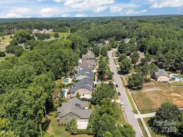 113 Chaska Loop, Troutman, NC 28166 - aerial view of residential area featuring a heavily wooded area