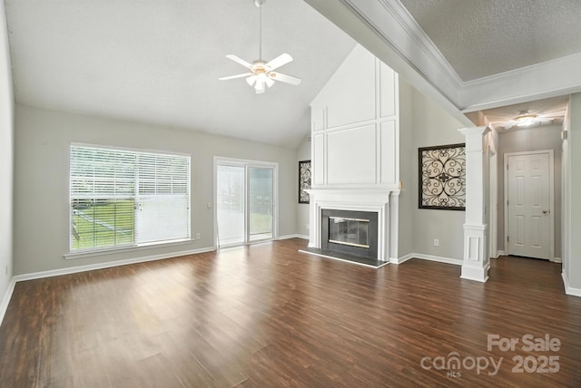 247 Aylesbury Ln, Indian Trail, NC 28079 - unfurnished living room featuring decorative columns, a ceiling fan, a large fireplace, dark wood finished floors, and high vaulted ceiling