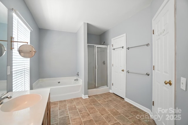 247 Aylesbury Ln, Indian Trail, NC 28079 - full bathroom with a garden tub, a stall shower, and vanity