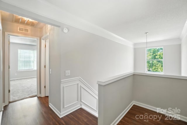 247 Aylesbury Ln, Indian Trail, NC 28079 - hall featuring healthy amount of natural light, dark wood-type flooring, an upstairs landing, and ornamental molding