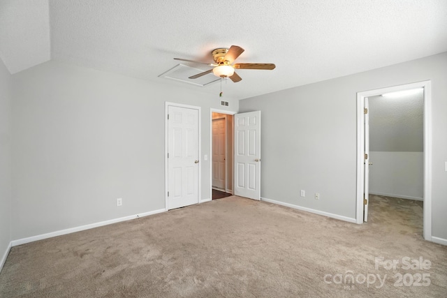 247 Aylesbury Ln, Indian Trail, NC 28079 - unfurnished bedroom with carpet floors, a ceiling fan, a walk in closet, a textured ceiling, and a closet