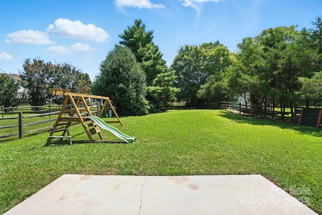 247 Aylesbury Ln, Indian Trail, NC 28079 - fenced backyard with a playground and a patio