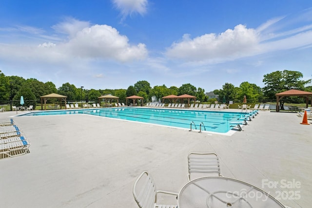 247 Aylesbury Ln, Indian Trail, NC 28079 - community pool with a gazebo, a patio area, and view of wooded area