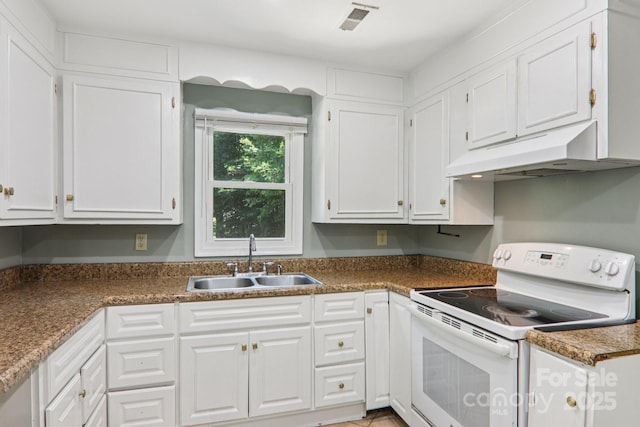 1416 Roy Dula Pl SW, Lenoir, NC 28645 - kitchen with electric range, under cabinet range hood, white cabinets, and dark countertops