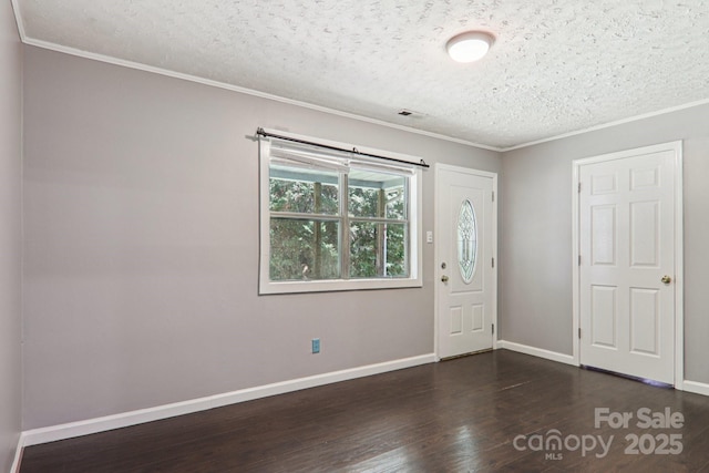 1416 Roy Dula Pl SW, Lenoir, NC 28645 - unfurnished room with a textured ceiling, dark wood-style floors, and crown molding