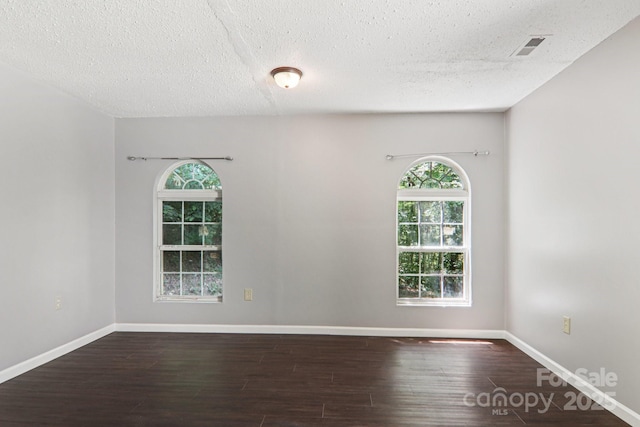 1416 Roy Dula Pl SW, Lenoir, NC 28645 - spare room with wood finished floors and a textured ceiling