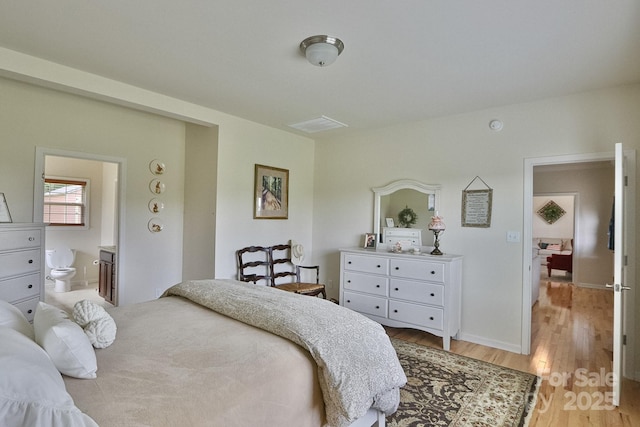 485 Calloway Rd, Lowgap, NC 27024 - bedroom featuring light wood-style flooring and ensuite bath