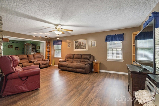 3149 Simmons St, Kannapolis, NC 28083 - living area featuring a ceiling fan, a textured ceiling, wood finished floors, and ornate columns
