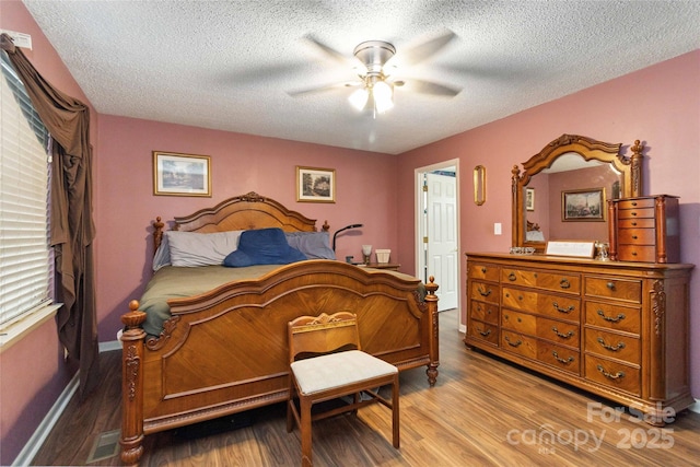 3149 Simmons St, Kannapolis, NC 28083 - bedroom with wood finished floors, a textured ceiling, and a ceiling fan