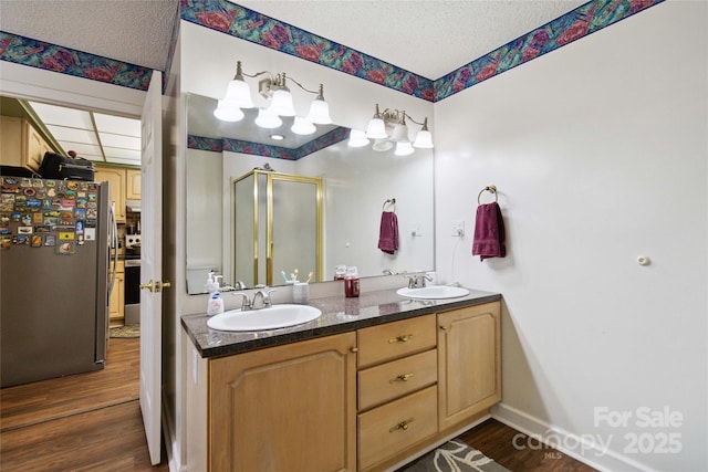 3149 Simmons St, Kannapolis, NC 28083 - full bath with wood finished floors, a stall shower, double vanity, and a textured ceiling