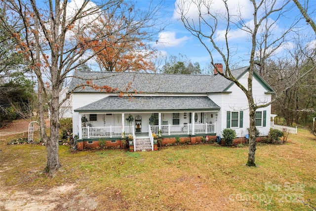 2633 Jb Denton Rd, Lancaster, SC 29720 - view of front of home featuring a porch, roof with shingles, a chimney, and a front yard