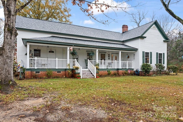 2633 Jb Denton Rd, Lancaster, SC 29720 - view of front of house with covered porch, a shingled roof, a chimney, and a front lawn