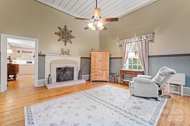 2633 Jb Denton Rd, Lancaster, SC 29720 - living room featuring a tile fireplace, ceiling fan, wood finished floors, and lofted ceiling