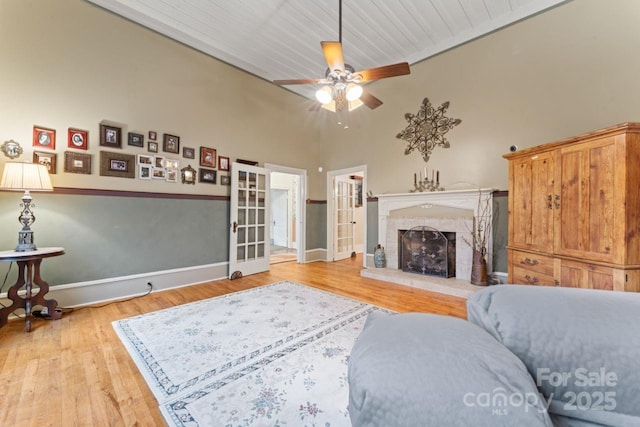 2633 Jb Denton Rd, Lancaster, SC 29720 - living room featuring light wood-style floors, ceiling fan, and a fireplace with raised hearth