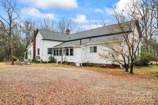 2633 Jb Denton Rd, Lancaster, SC 29720 - back of property featuring a shingled roof, a chimney, crawl space, and entry steps