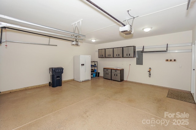 19421 Beaufain St, Cornelius, NC 28031 - garage with a garage door opener, electric panel, and white fridge with ice dispenser
