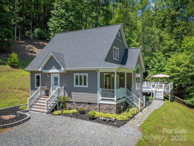 7376 NC-181 Hwy, Morganton, NC 28655 - view of front facade with roof with shingles, crawl space, a front yard, a view of trees, and covered porch