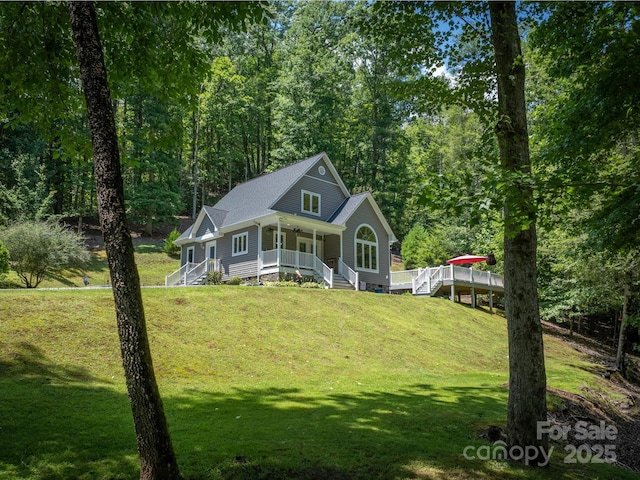7376 NC-181 Hwy, Morganton, NC 28655 - view of front of house with a porch, stairs, a front yard, and roof with shingles